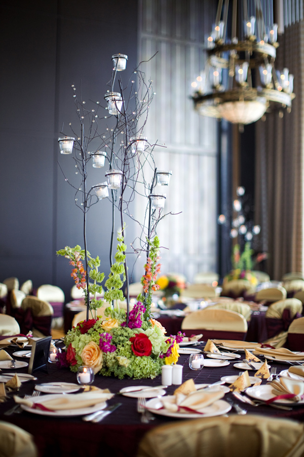 Modern centerpiece with hanging candles - wedding photo by Melissa Jill Photography